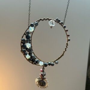 Homemade black jasper crescent moon charm.